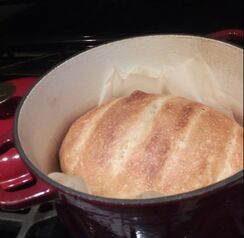 A loaf of bread in a dutch oven